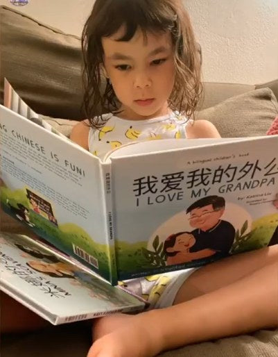 A family reading a Lychee Press book