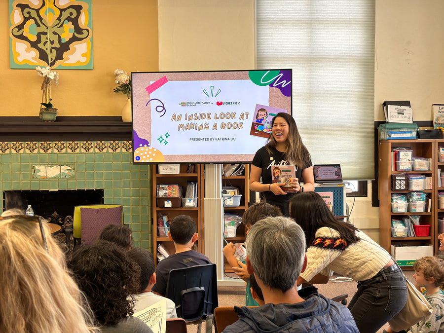 Katrina Liu, children's book author, holding The Gratitude Jar while presenting An Inside Look at Making a Book to students at Orion Alternative School