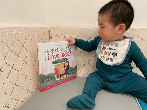 A family reading a Lychee Press book