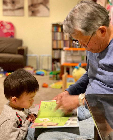 A family reading a Lychee Press book