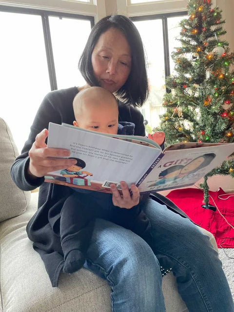 A family reading a Lychee Press book