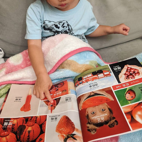 A family reading a Lychee Press book