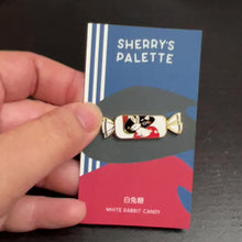 Load and play video in Gallery viewer, White Rabbit Candy enamel pin designed by Sherry&#39;s Palette
