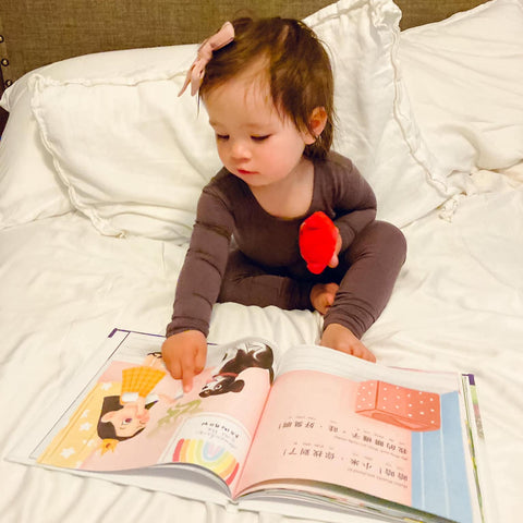 A family reading a Lychee Press book