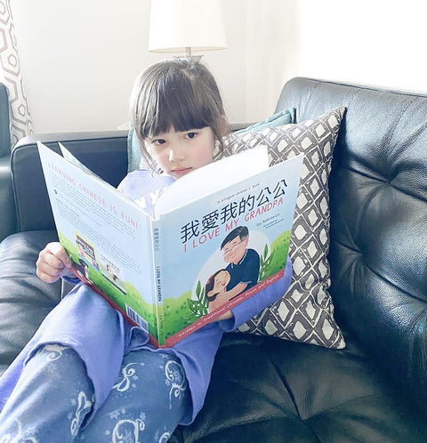A family reading a Lychee Press book