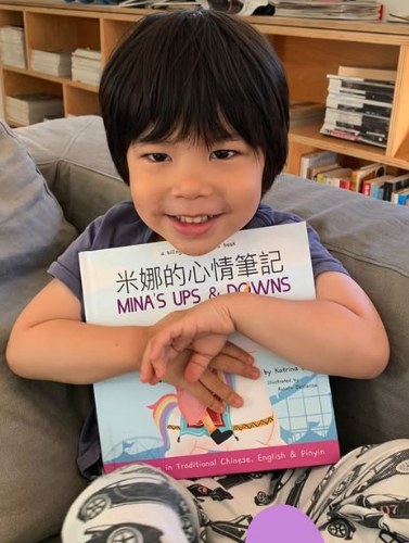A family reading a Lychee Press book