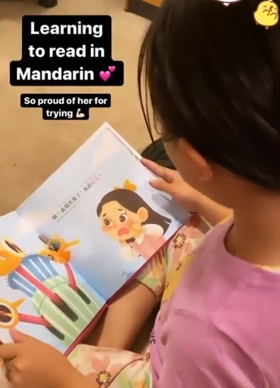 A family reading a Lychee Press book
