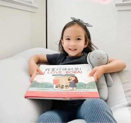 A family reading a Lychee Press book