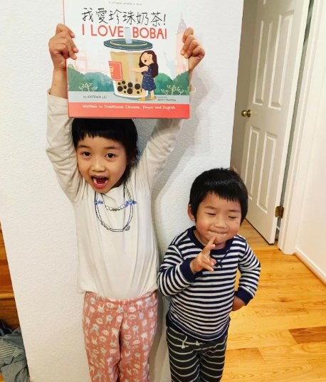 A family reading a Lychee Press book