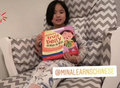 A family reading a Lychee Press book